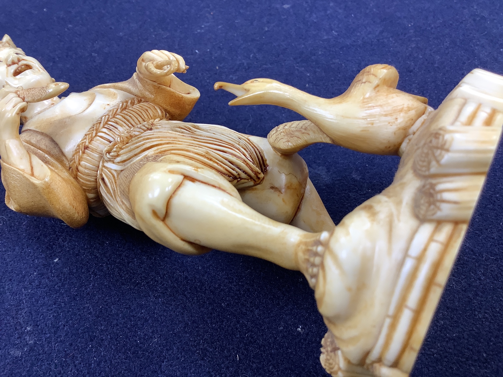 A Japanese ivory figure of a cormorant fisherman, early 20th century